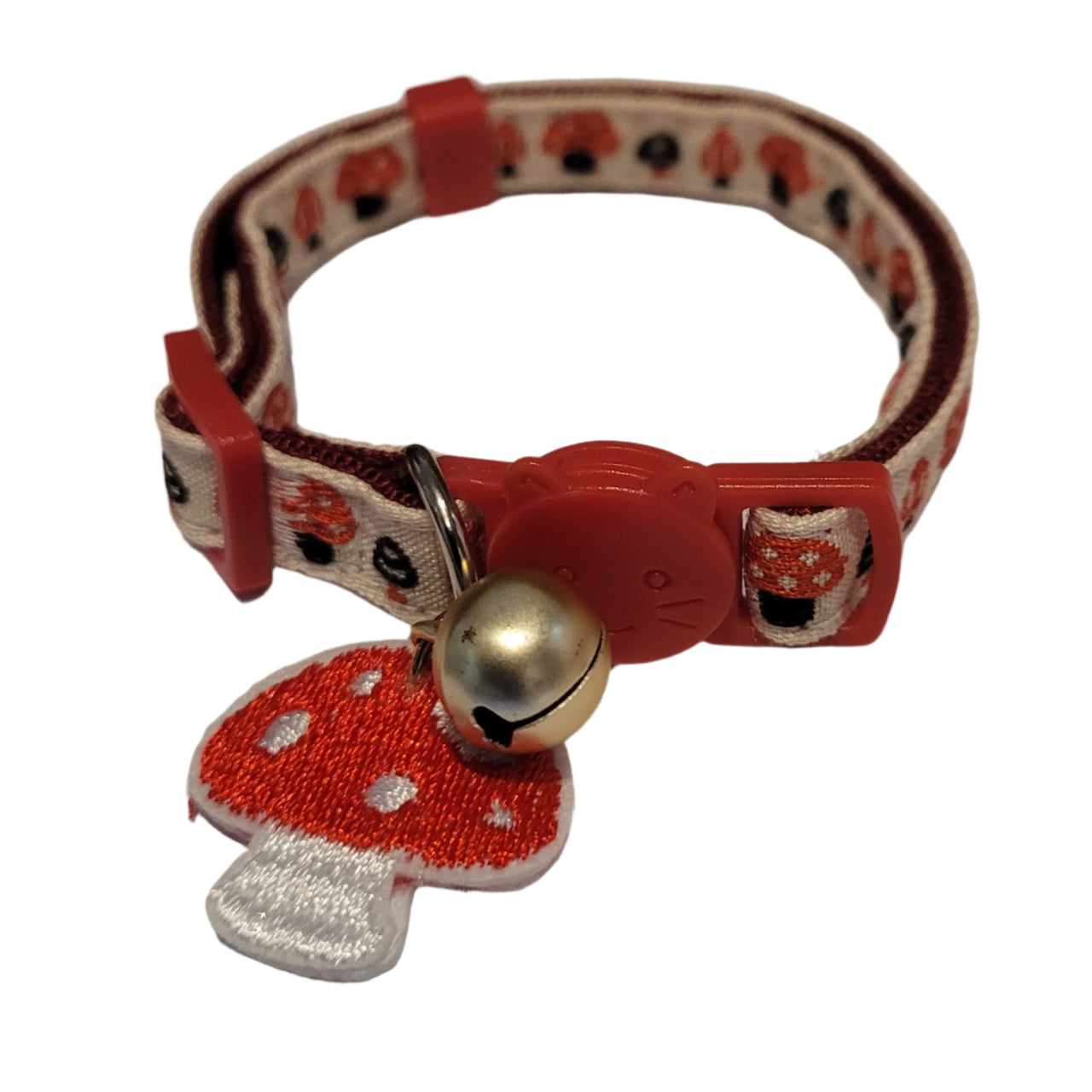Red and white cat collar with mushroom charm and bell